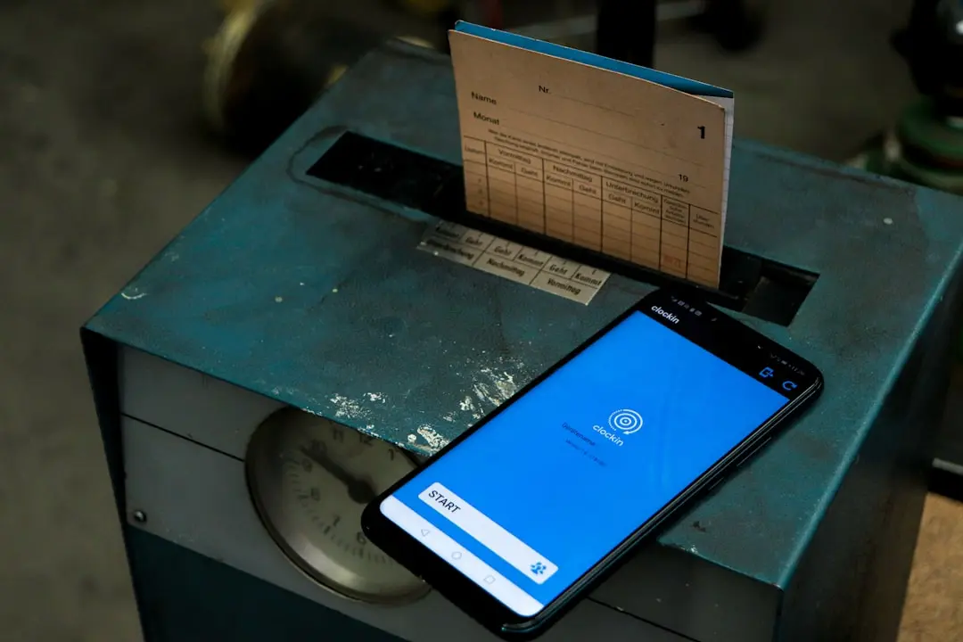 a cell phone sitting on top of a metal box — Photo by Jonas Tünte on Unsplash