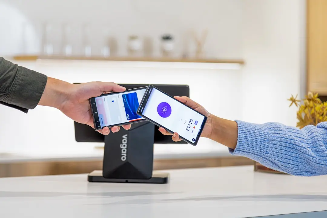 Mobile payment transaction being completed with phone. — Photo by Vagaro on Unsplash