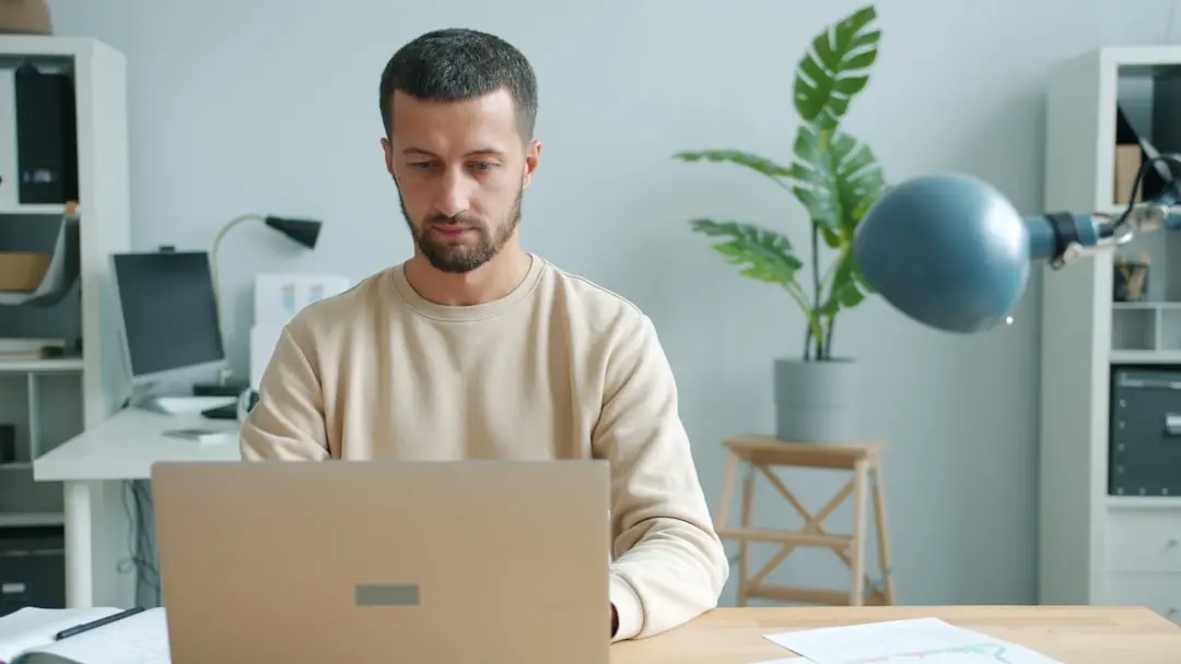 Man working on a laptop at a desk. — Photo by Vitaly Gariev on Unsplash
