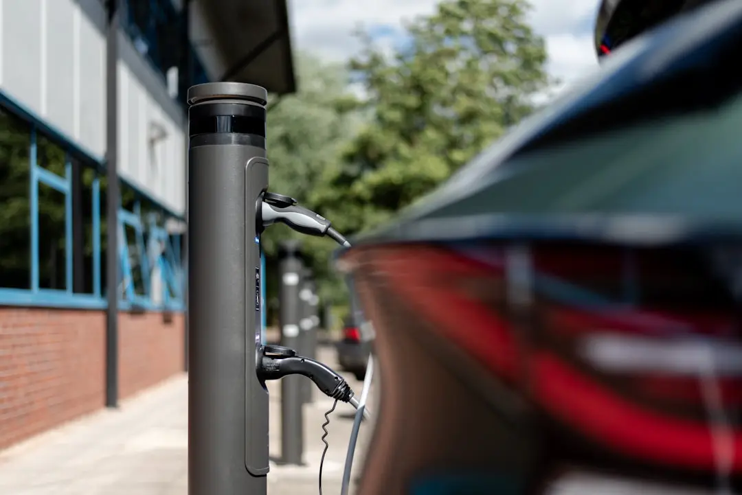 An electric car is charging at a charging station. — Photo by Ratio EV Charging on Unsplash