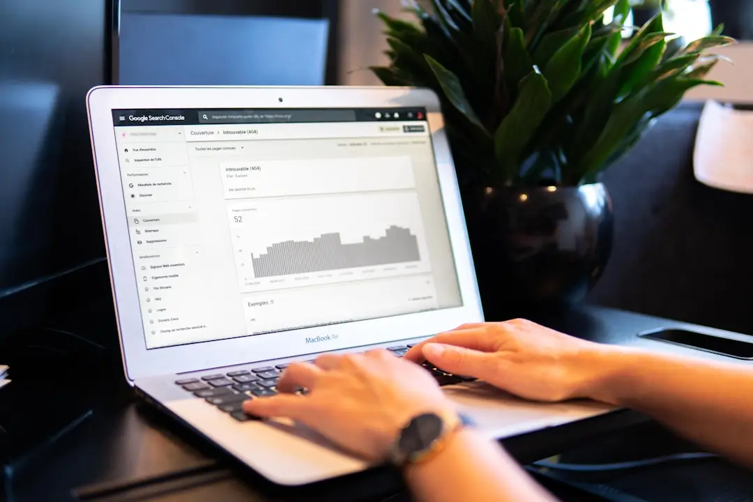 person using macbook air on brown wooden table — Photo by Myriam Jessier on Unsplash