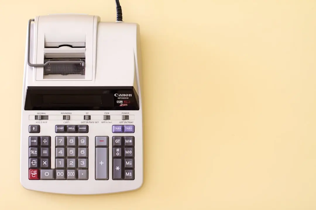 white Canon cash register — Photo by StellrWeb on Unsplash