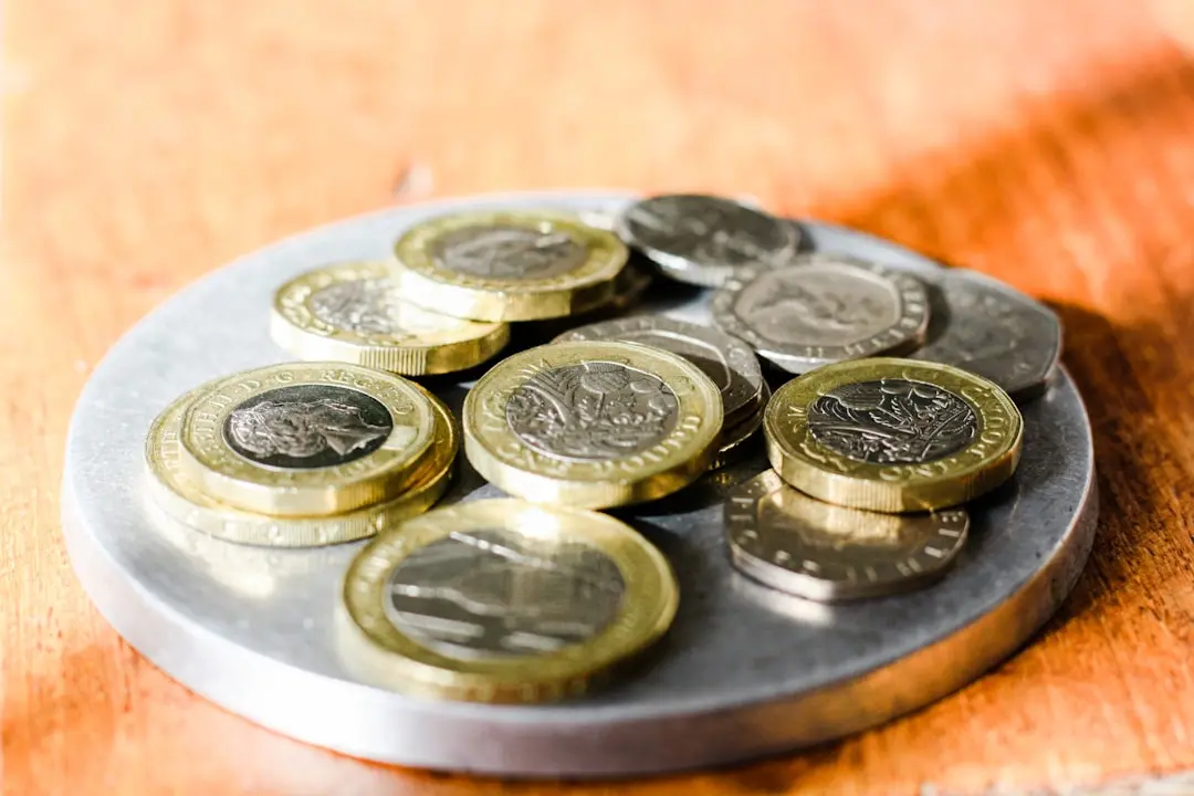silver and gold round coins — Photo by Sarah Agnew on Unsplash