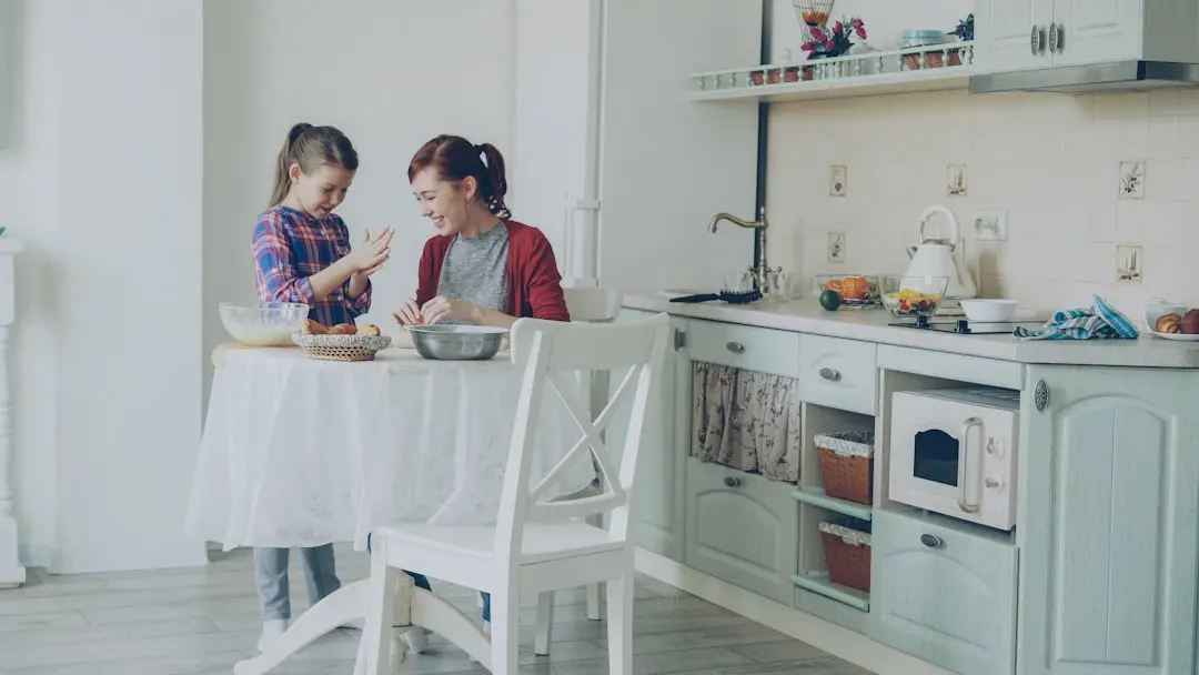 A mother and daughter bake together in the kitchen. — Photo by Vitaly Gariev on Unsplash