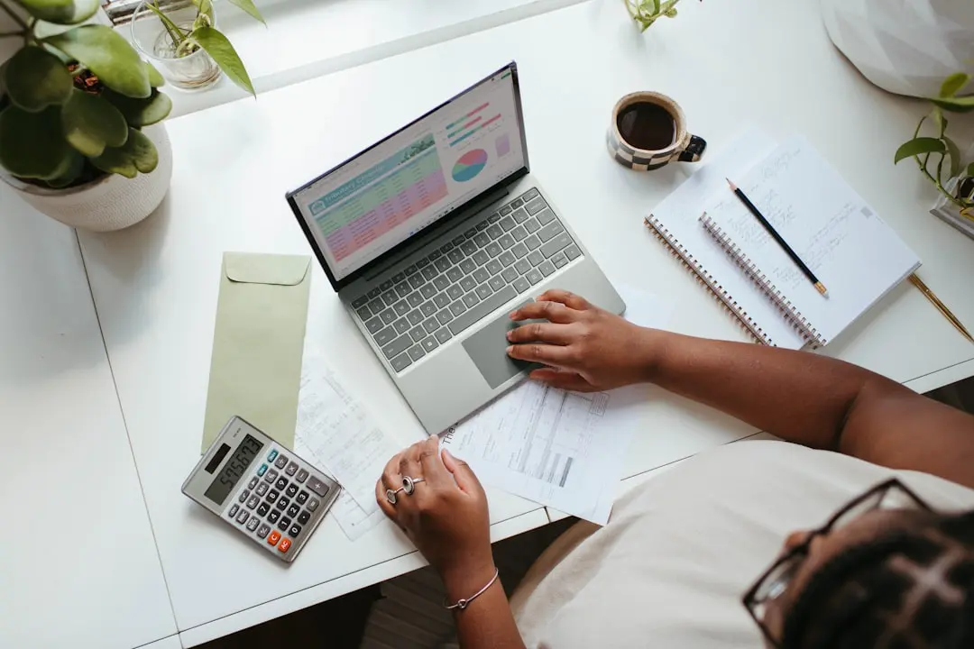a person sitting at a table with a laptop — Photo by Microsoft 365 on Unsplash