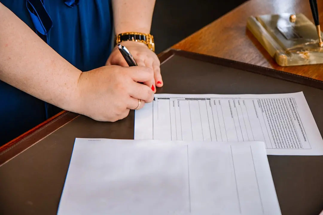 person holding pen and writing on paper — Photo by Leon Seibert on Unsplash