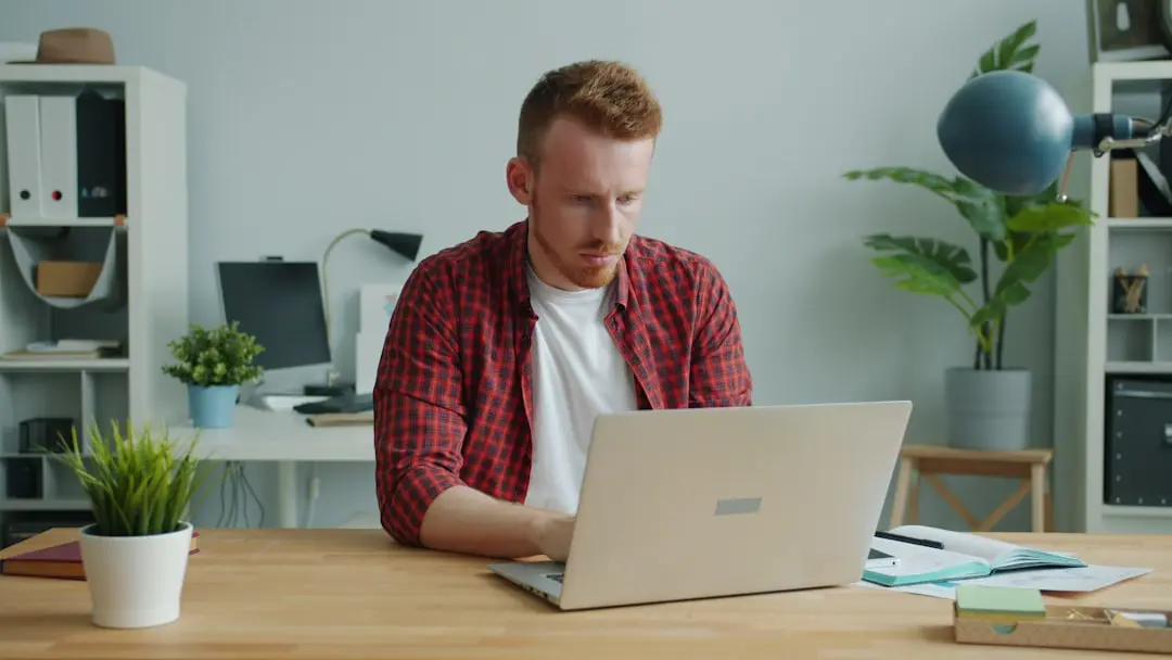 Man working on a laptop at a desk. — Photo by Vitaly Gariev on Unsplash
