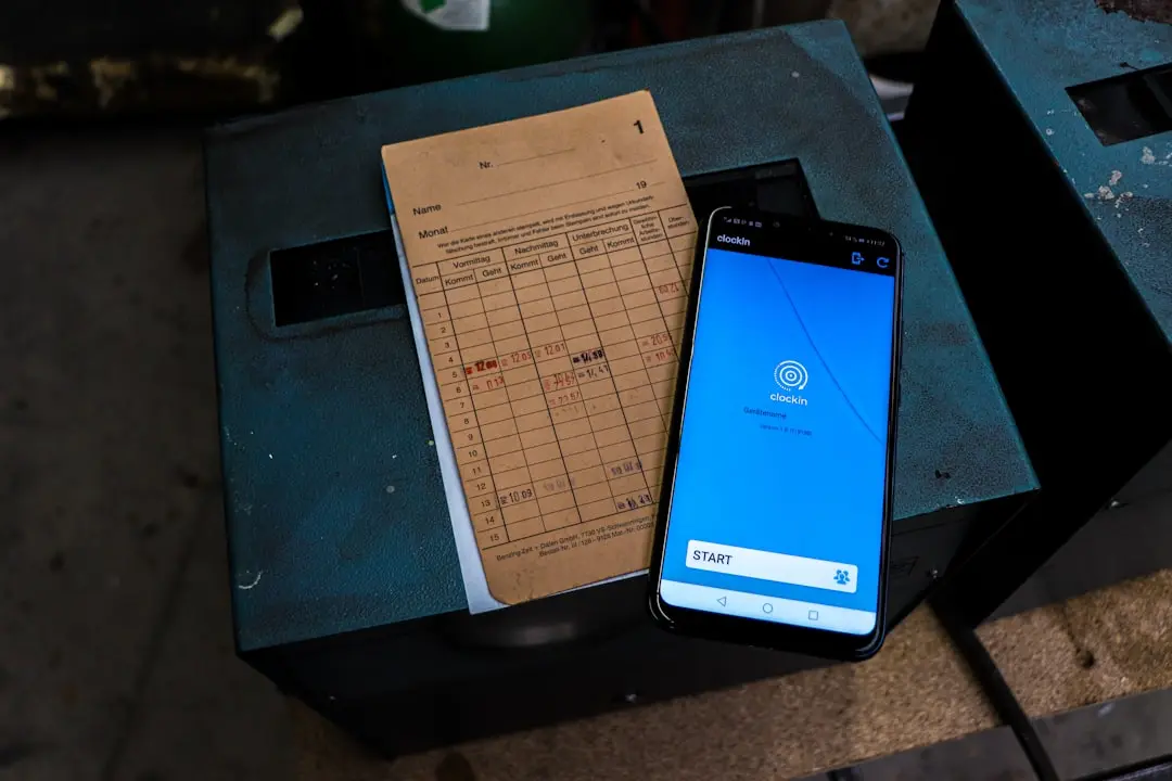 a cell phone sitting on top of a table next to a piece of paper — Photo by Jonas Tünte on Unsplash