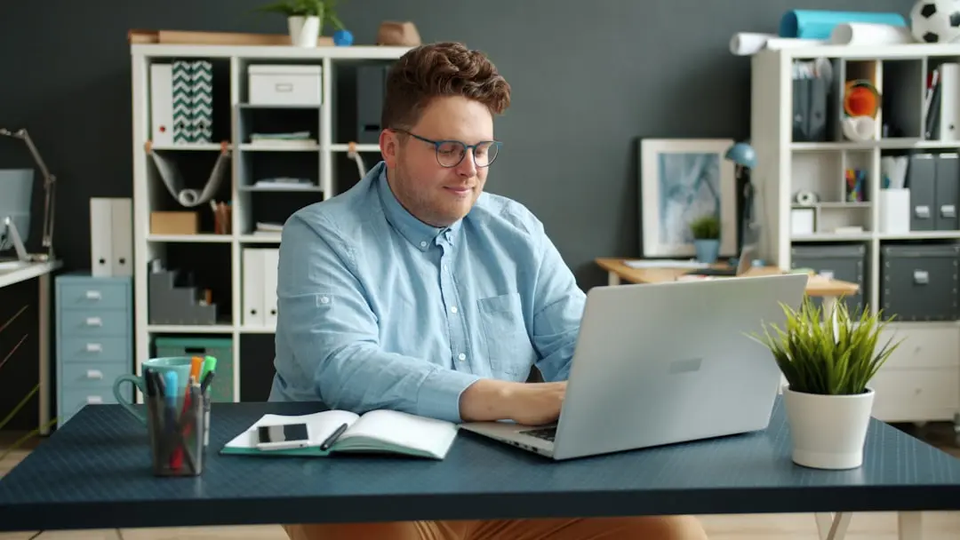 Man working on laptop at desk in office. — Photo by Vitaly Gariev on Unsplash