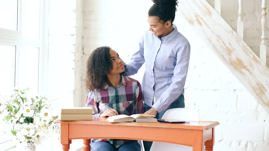 Mother and daughter studying together at a desk. — Photo by Vitaly Gariev on Unsplash