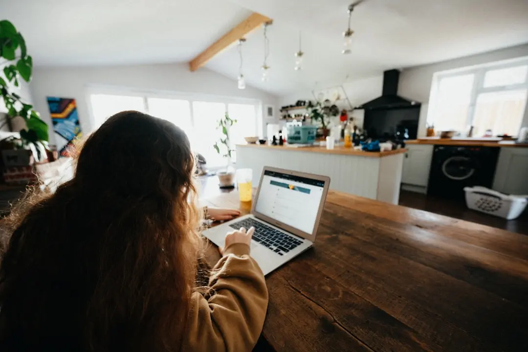 woman in brown sweater using macbook pro — Photo by Annie Spratt on Unsplash