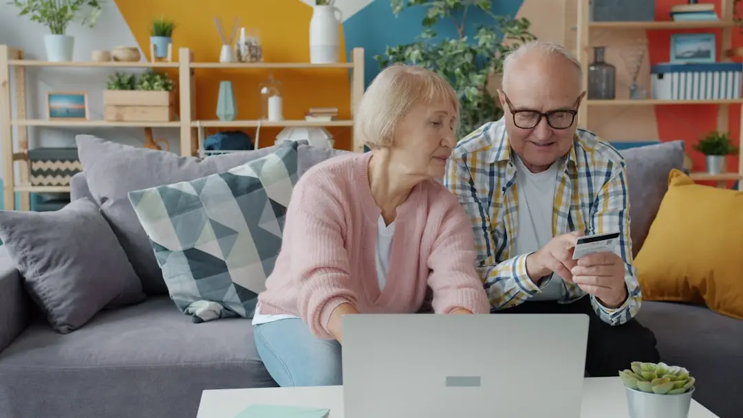 Elderly couple shopping online with credit card and laptop. — Photo by Vitaly Gariev on Unsplash