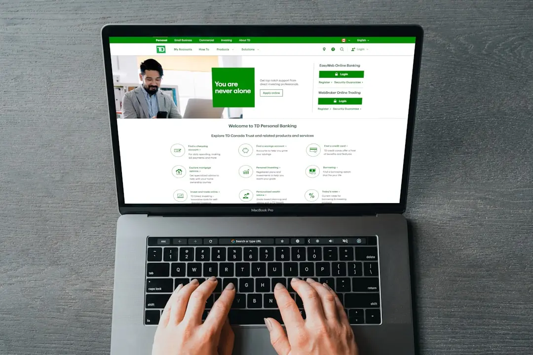 a person typing on a laptop with their hands — Photo by PiggyBank on Unsplash