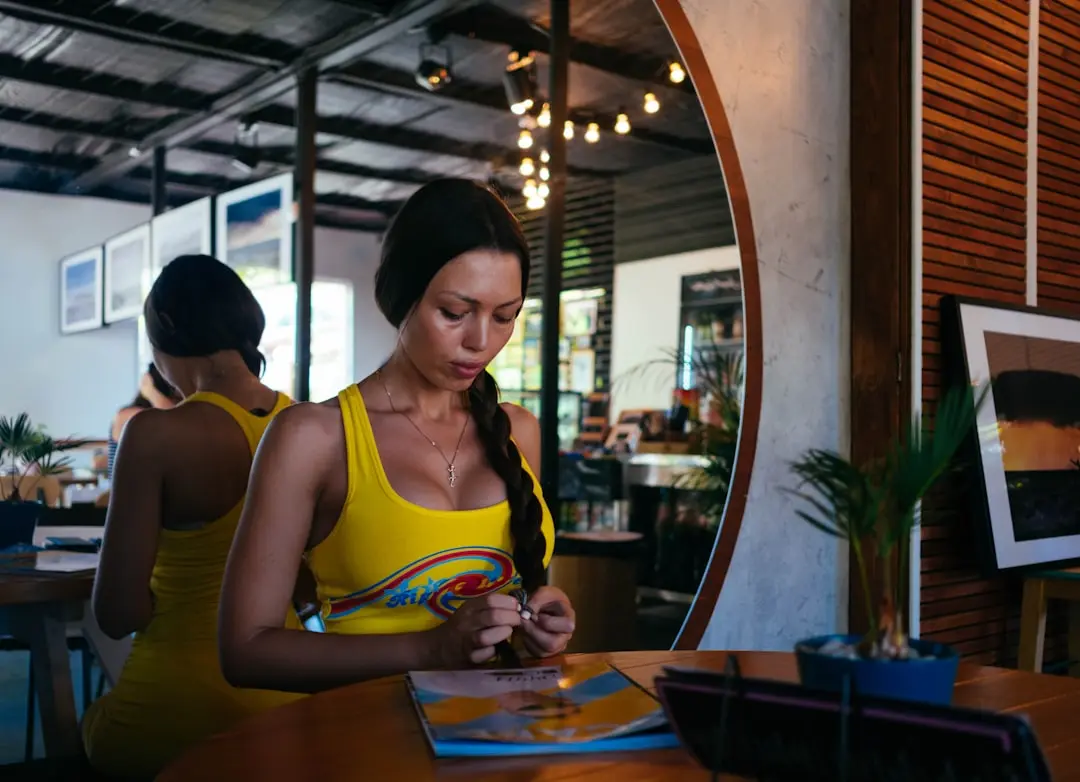 woman standing in front of table — Photo by Igor Starkov on Unsplash