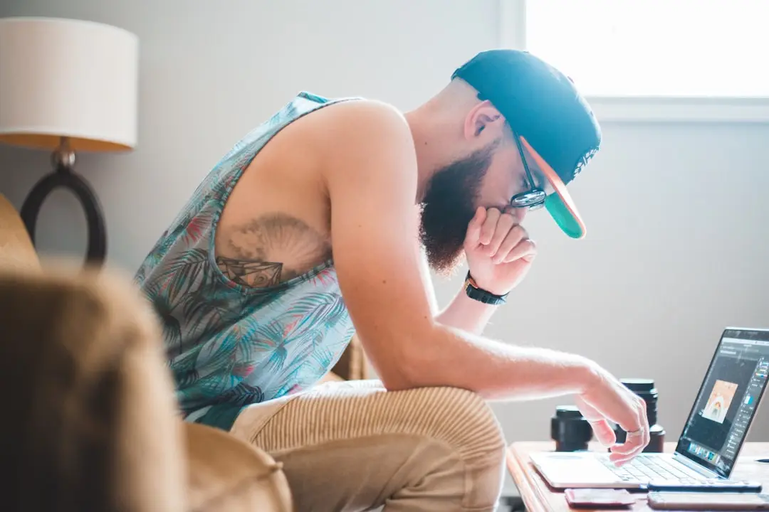 man sitting in front of laptop computer — Photo by Erik Mclean on Unsplash