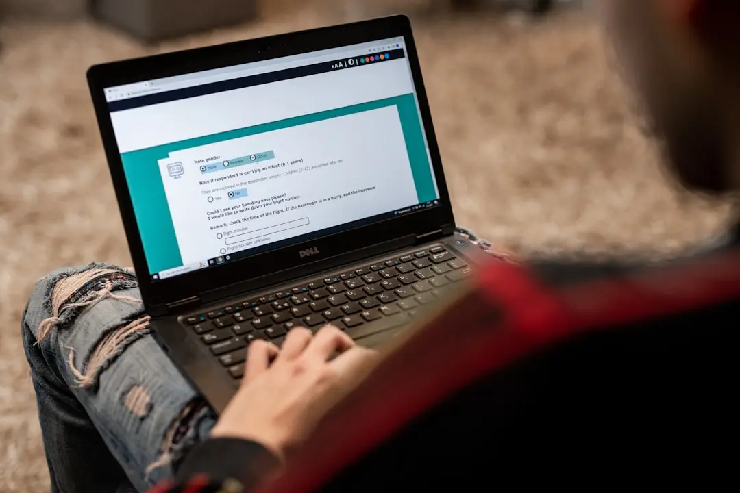 a person sitting on the floor using a laptop — Photo by ODISSEI on Unsplash