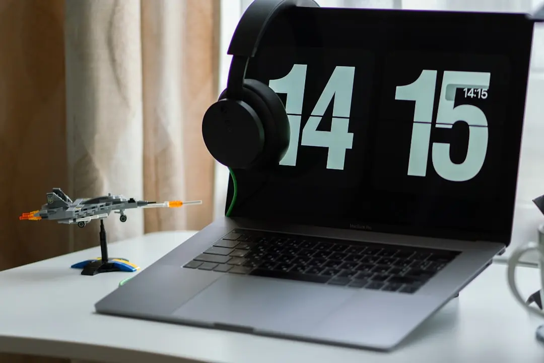 a laptop with headphones on — Photo by Eugene Chystiakov on Unsplash